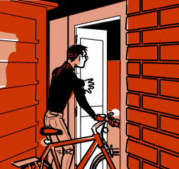 Percy has arrived home hand is walking his bike through the gate in to their back yard.